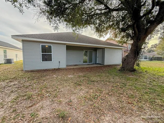 a house with trees in front of it