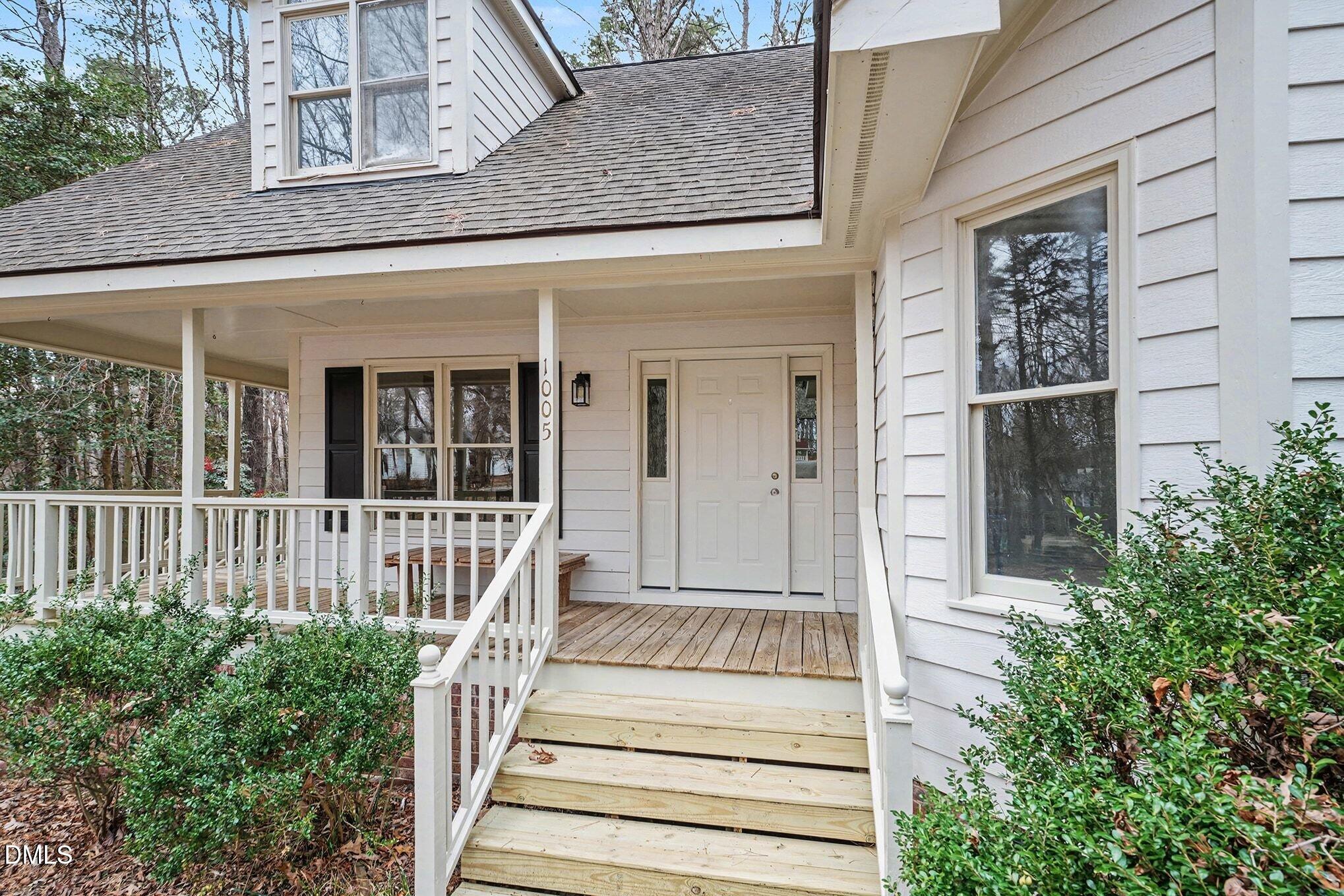 a view of a house with entrance and windows
