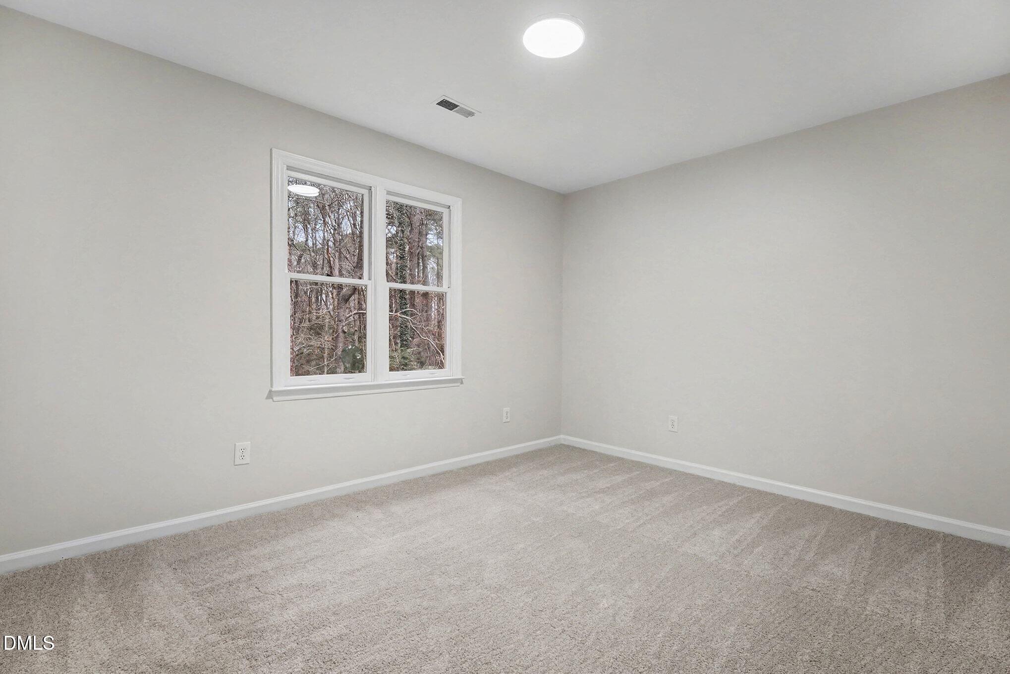 1005 Winsome Court Raleigh, NC 27603 - Photo 12 of 20 an empty room with a window