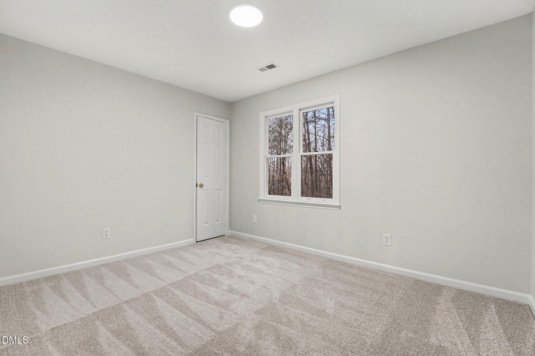 1005 Winsome Court Raleigh, NC 27603 - Photo 16 of 20 a view of an empty room with a window