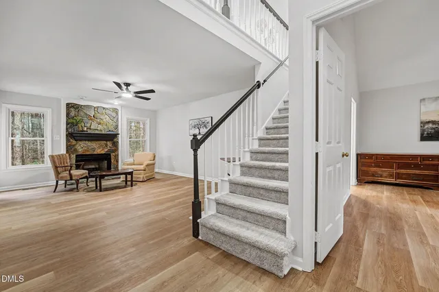 a view of front door with dining room and wooden floor