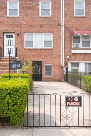 a front view of a building with garden