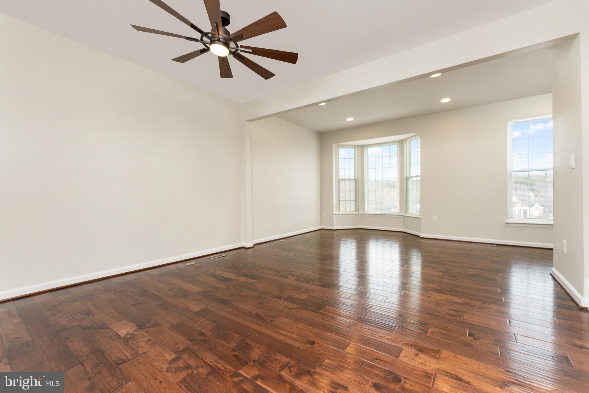 5311 Yellow Turtle Place Woodbridge, VA 22193 - Photo 12 of 36 wooden floor in an empty room with a window