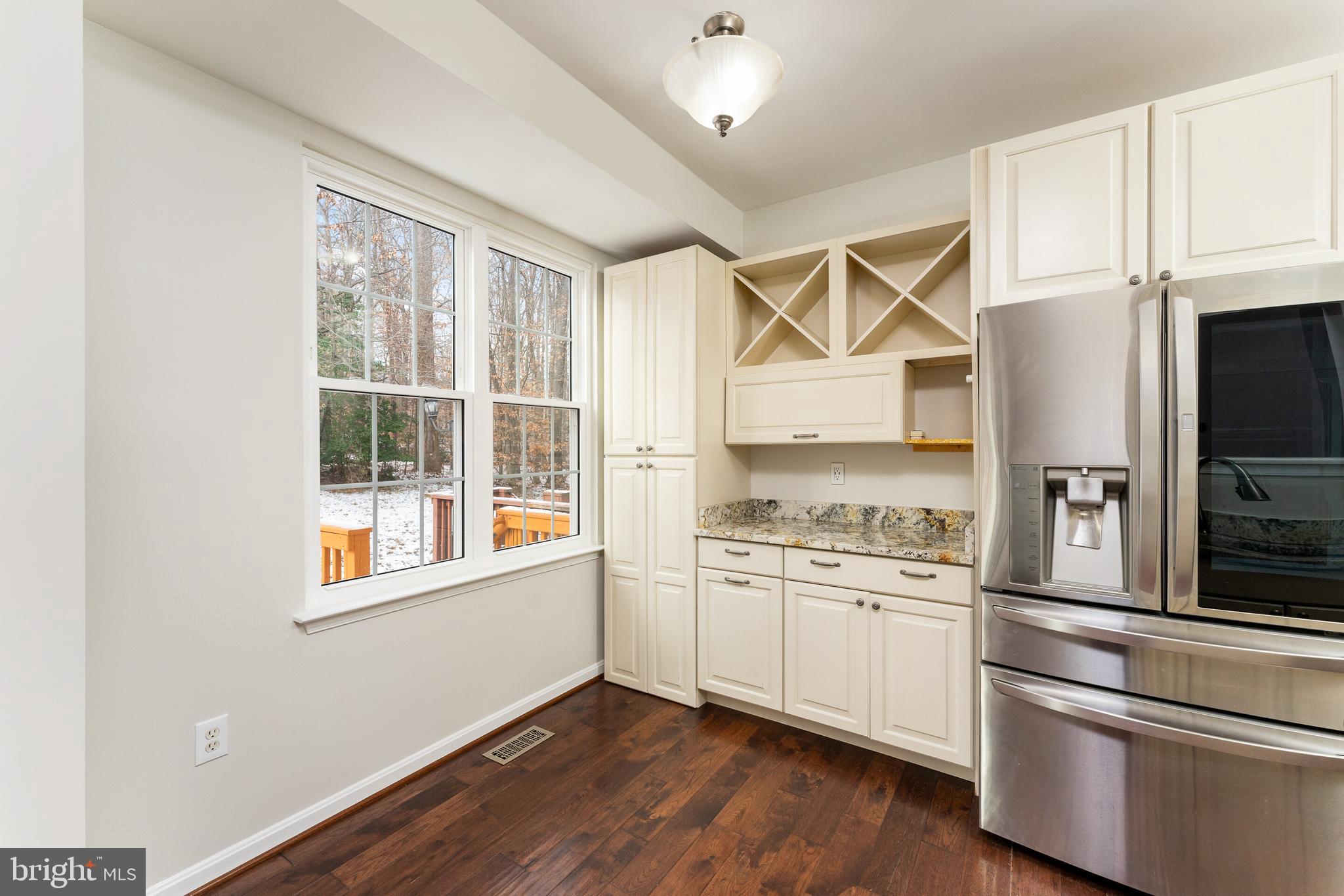 5311 Yellow Turtle Place Woodbridge, VA 22193 - Photo 17 of 36 a kitchen with stainless steel appliances granite countertop a stove and a refrigerator