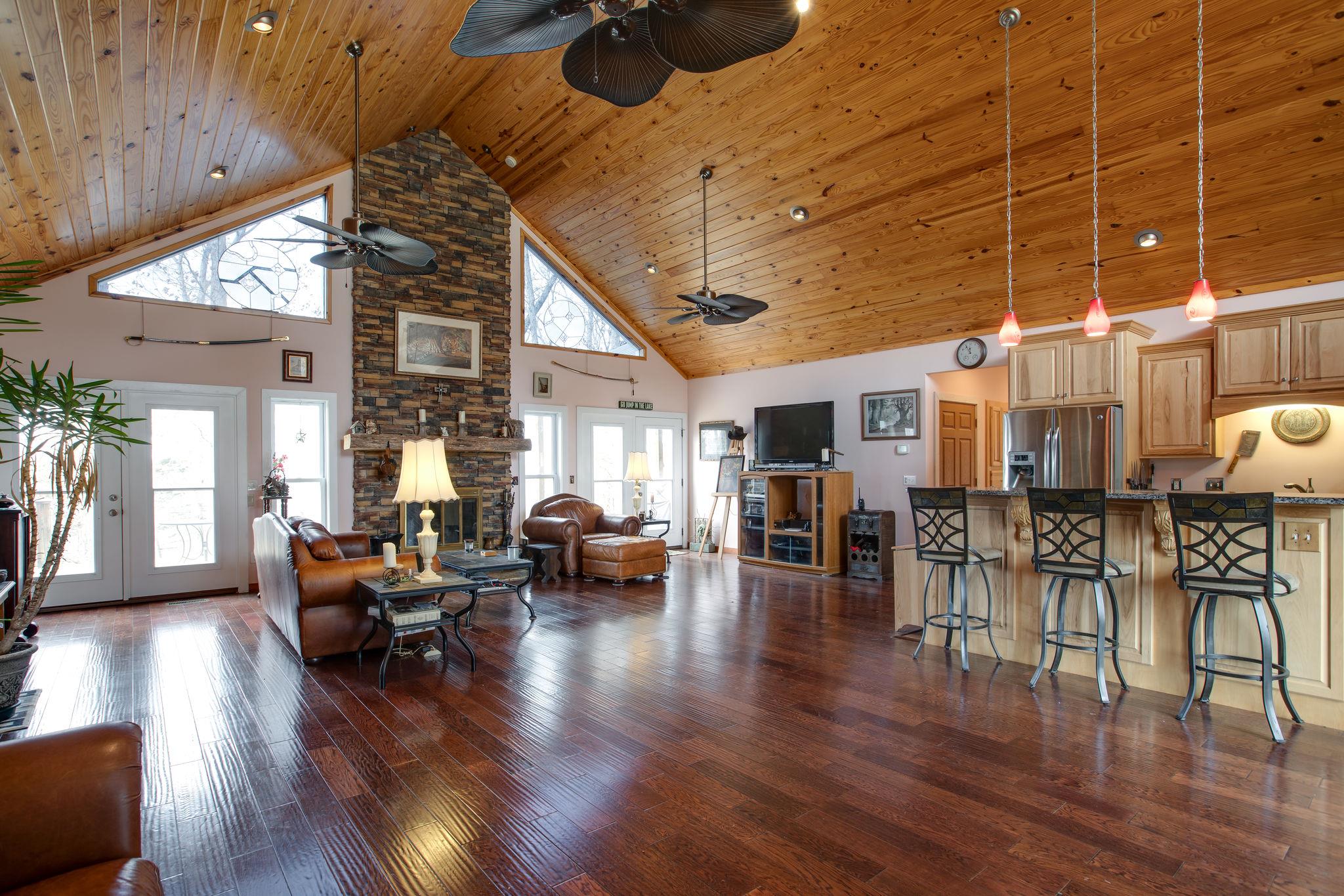 5150 Jefferson Road Smithville, TN 37166 - Photo 5 of 29 The Kitchen is perfectly placed and fully open to the Living Room. Notice the 27 foot stone-stacked wood-burning fireplace!