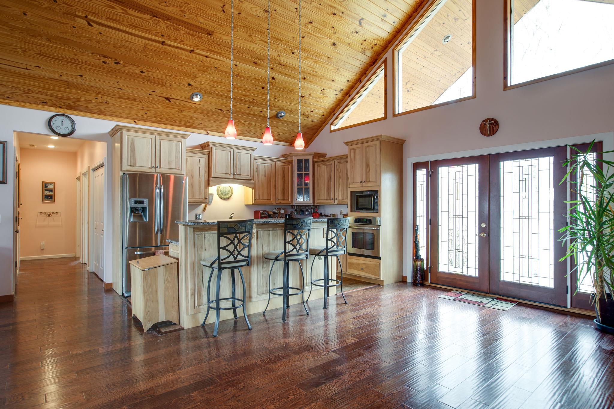5150 Jefferson Road Smithville, TN 37166 - Photo 7 of 29 The gorgeous Kitchen features locally sourced custom hickory cabinets, granite countertops, and a gas cooktop. A raised bar offers additional seating for everyone!