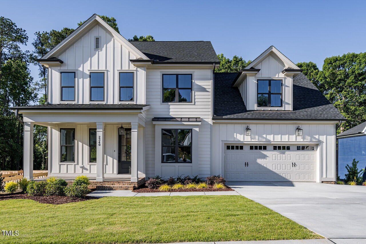 6045 Scalybark Road Durham, NC 27712 - Photo 1 of 30 a front view of a house with a yard