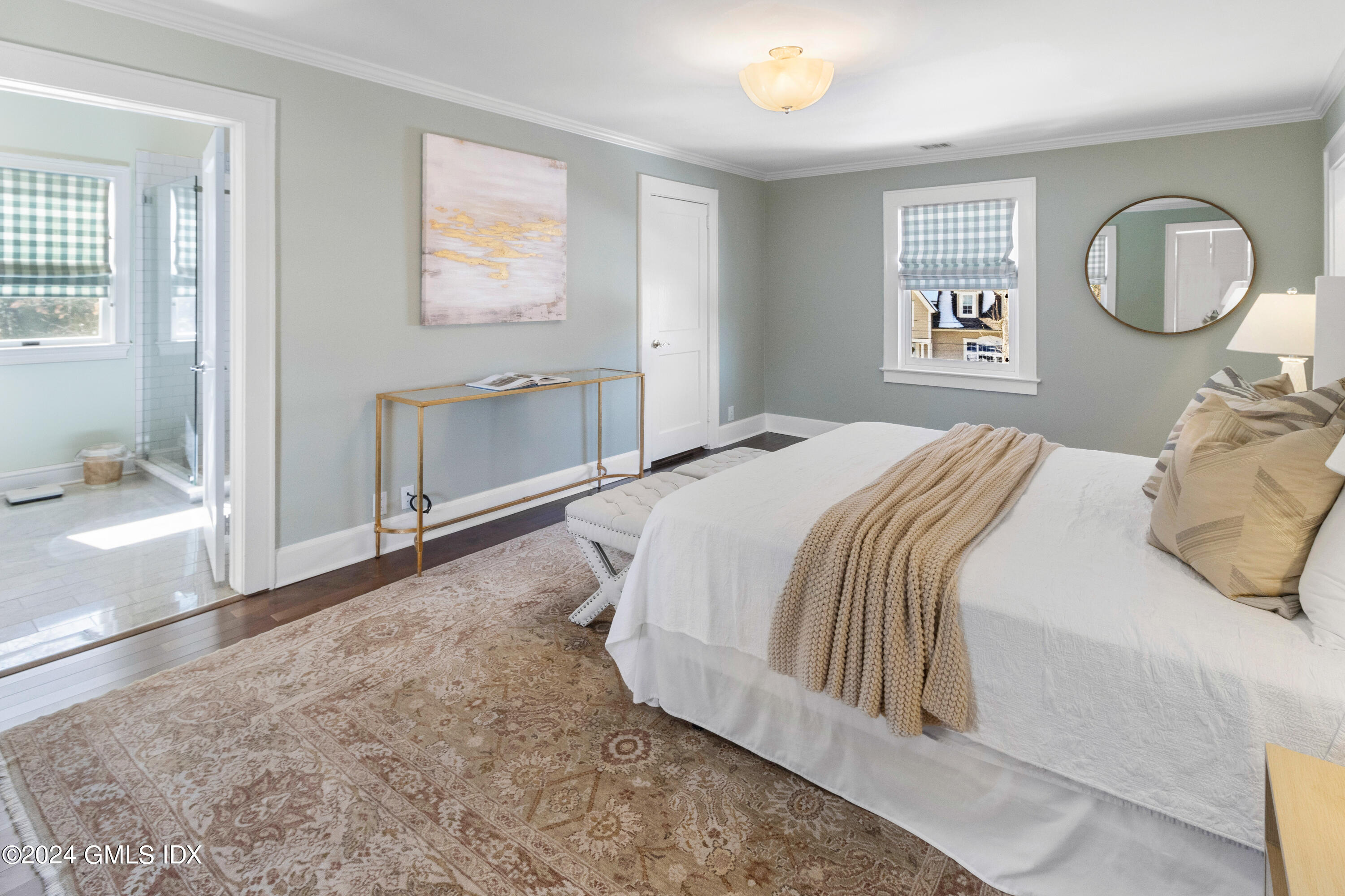 93 Valleywood Road Cos Cob, CT 06807 - Photo 11 of 22 a bedroom with a bed and a painting on the wall