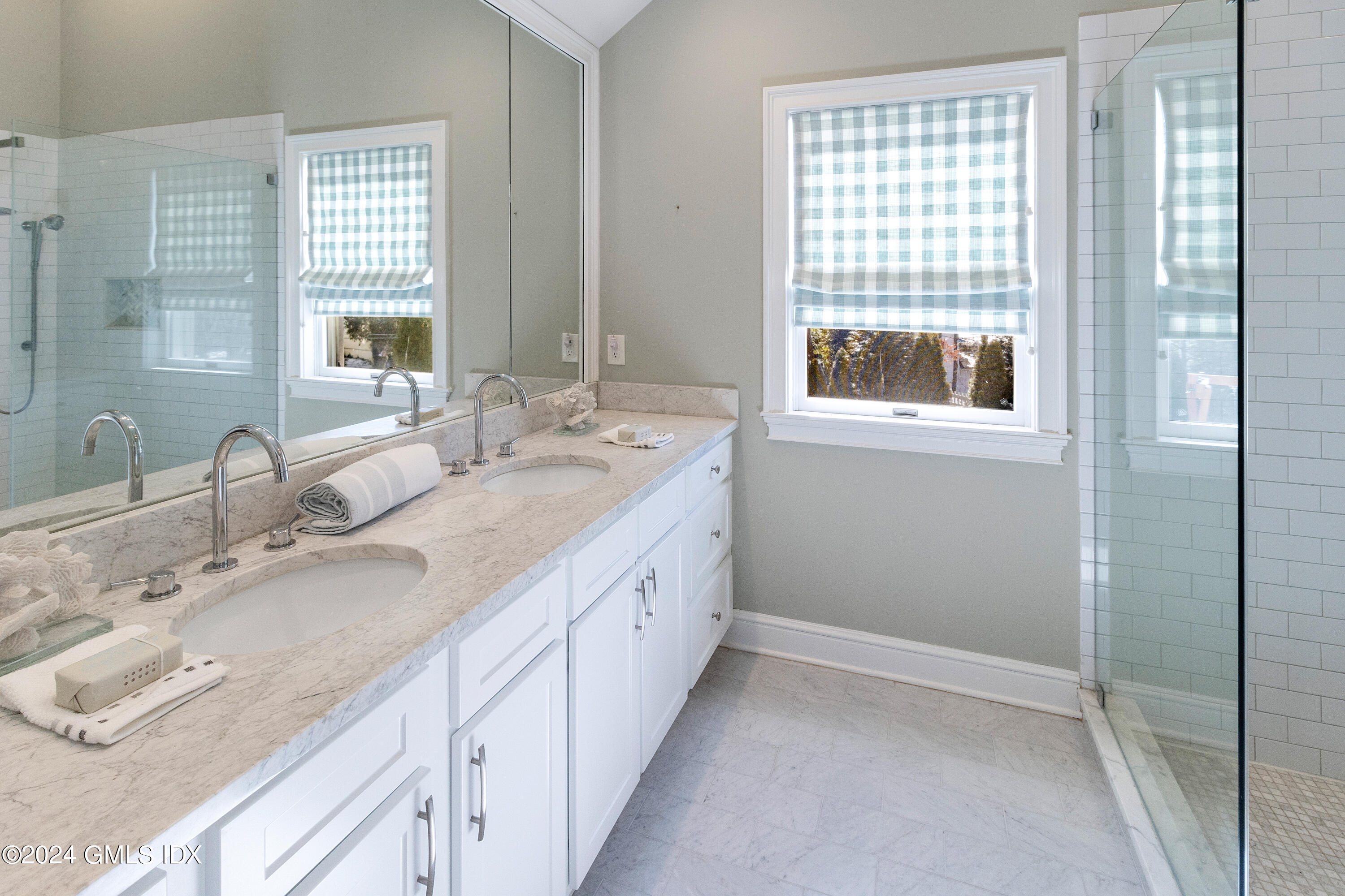 93 Valleywood Road Cos Cob, CT 06807 - Photo 12 of 22 a bathroom with double vanity and a mirror