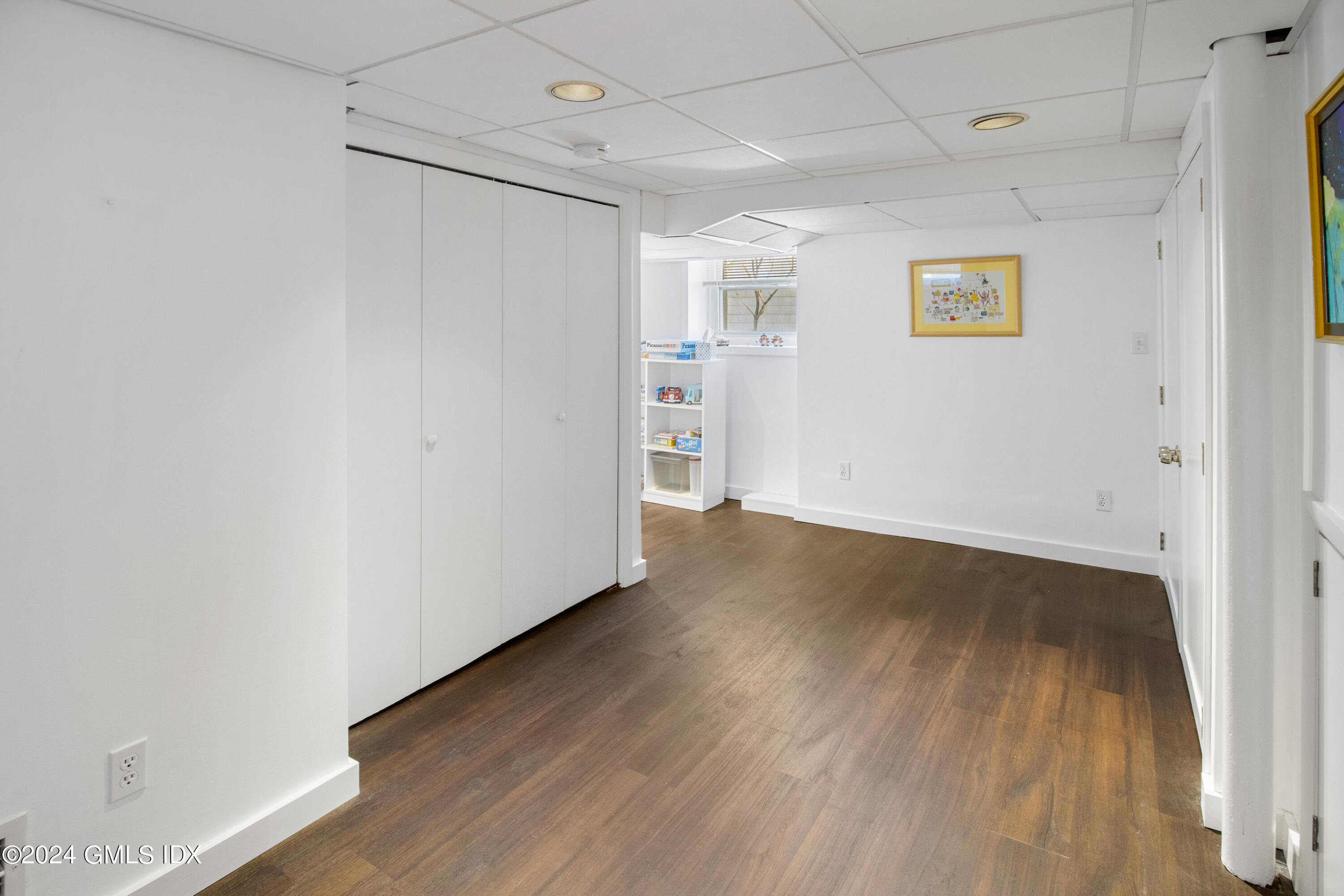 93 Valleywood Road Cos Cob, CT 06807 - Photo 17 of 22 a view of empty room with wooden floor