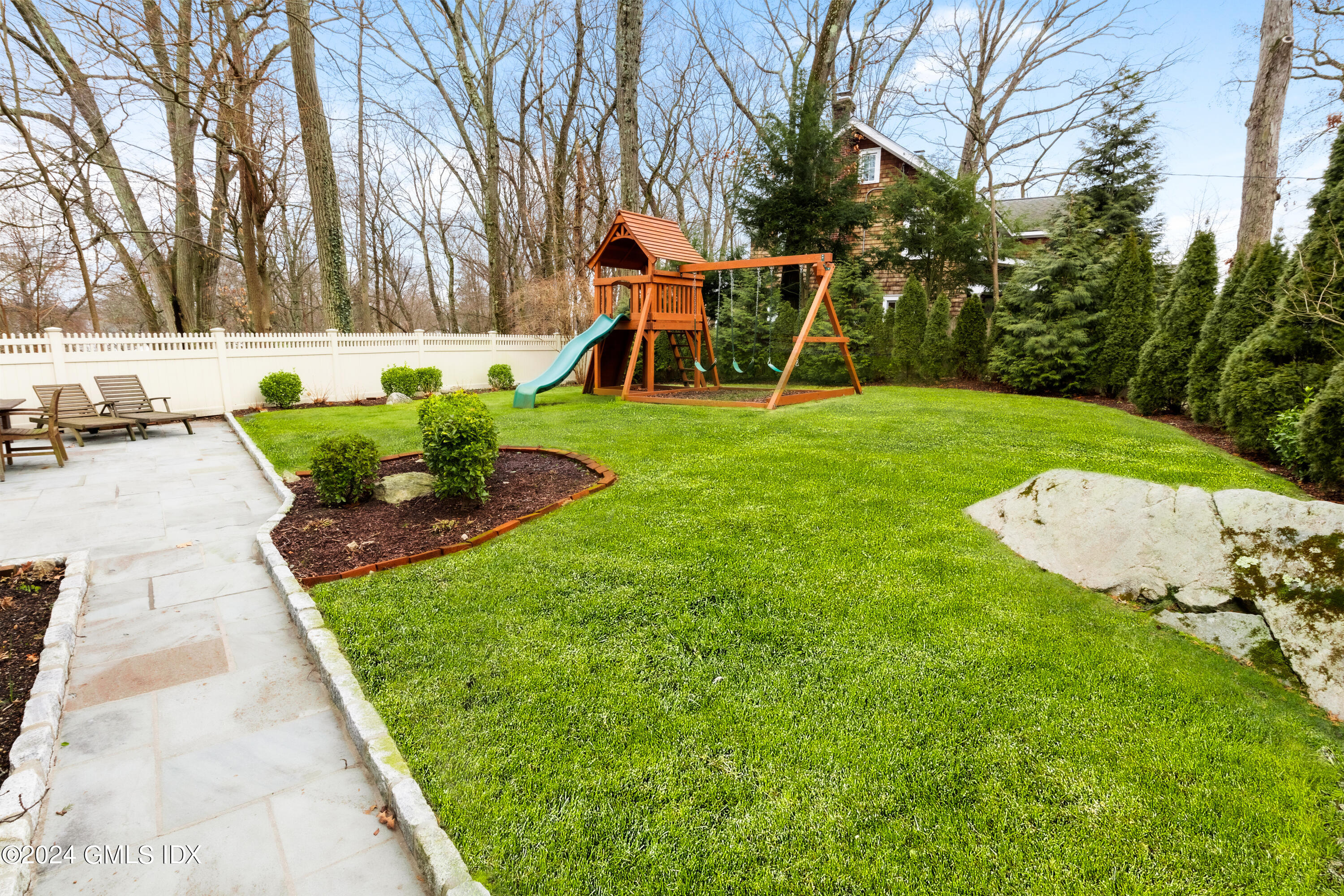 93 Valleywood Road Cos Cob, CT 06807 - Photo 18 of 22 a view of a backyard with swimming pool