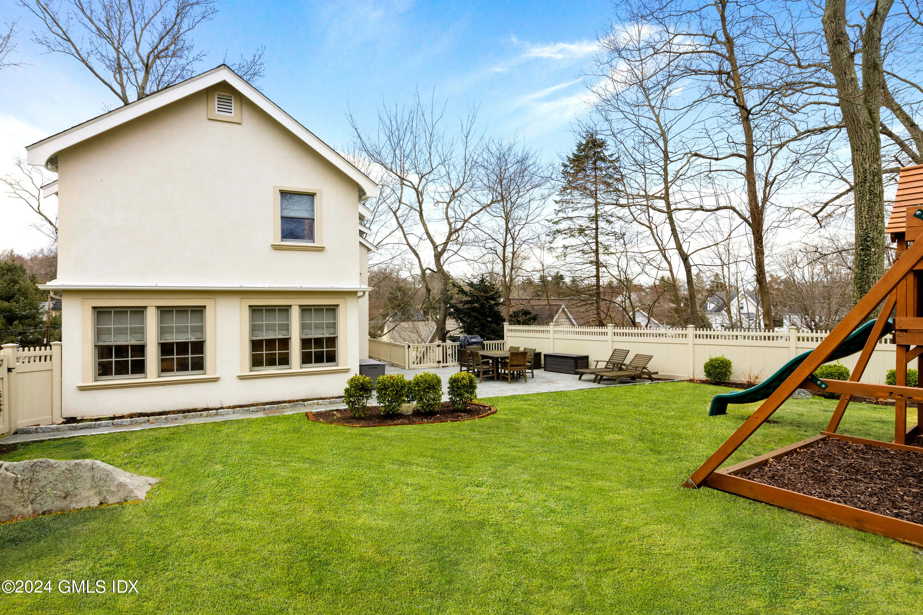 93 Valleywood Road Cos Cob, CT 06807 - Photo 19 of 22 a view of a house with a yard and sitting area