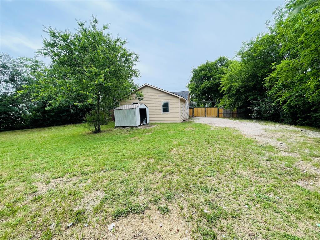 111 Rousseau Street Waxahachie, TX 75165 - Photo 22 of 22 a view of a house with a yard