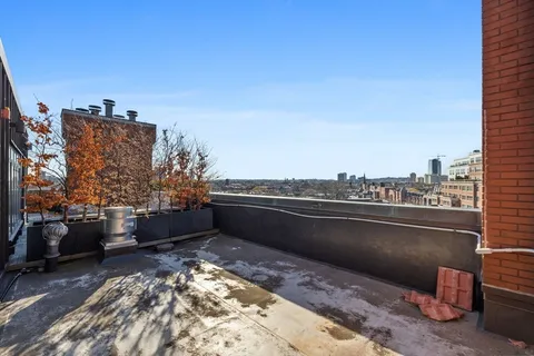 a view of balcony with furniture