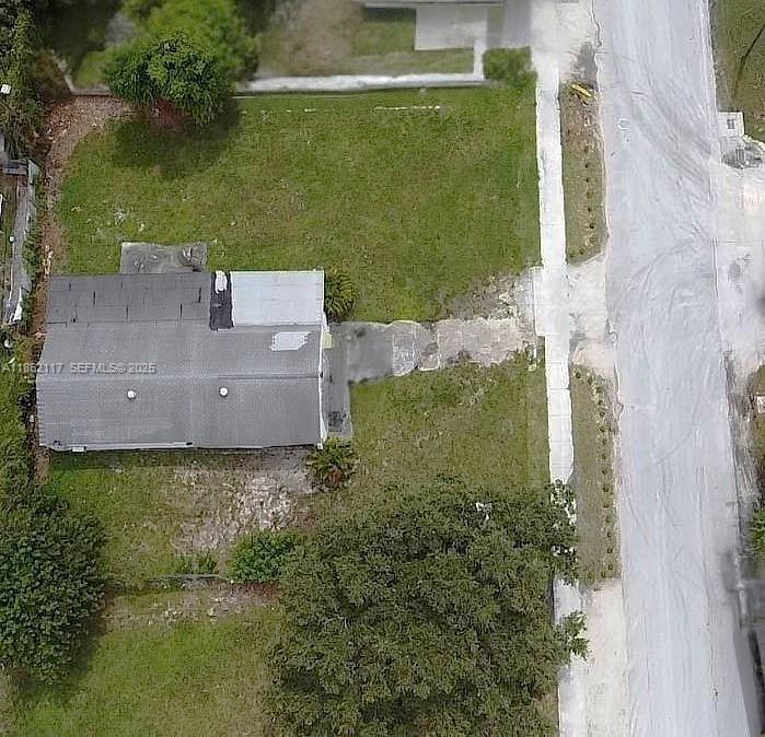 759 Northwest 73rd Street Miami, FL 33150 - Photo 6 of 9 an aerial view of a house with a yard