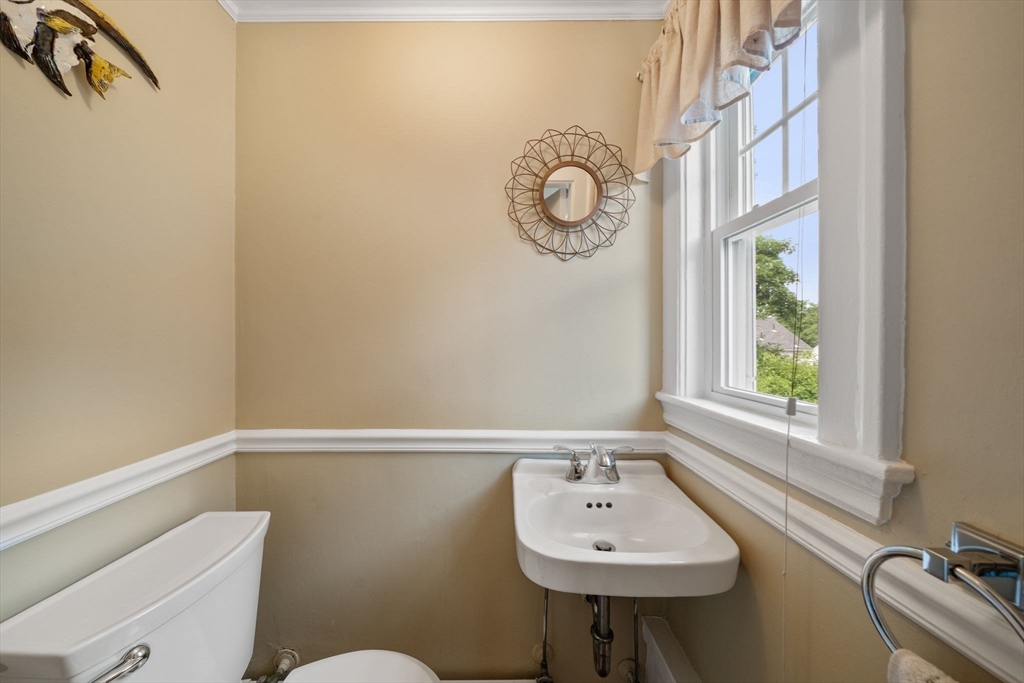 10 Parkview Road Reading, MA 01867 - Photo 17 of 31 a bathroom with a sink a toilet and a window