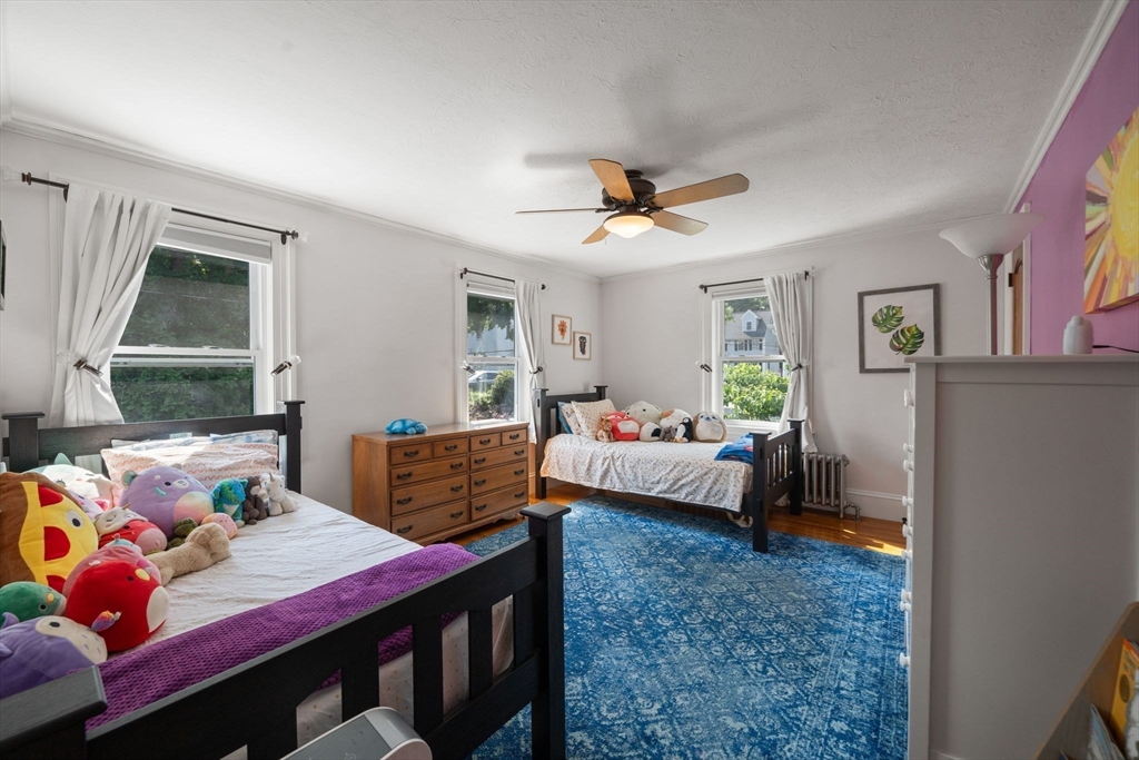 10 Parkview Road Reading, MA 01867 - Photo 22 of 31 a bedroom with a bed and wooden floor