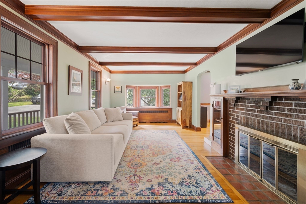 10 Parkview Road Reading, MA 01867 - Photo 6 of 31 a living room with furniture and a flat screen tv