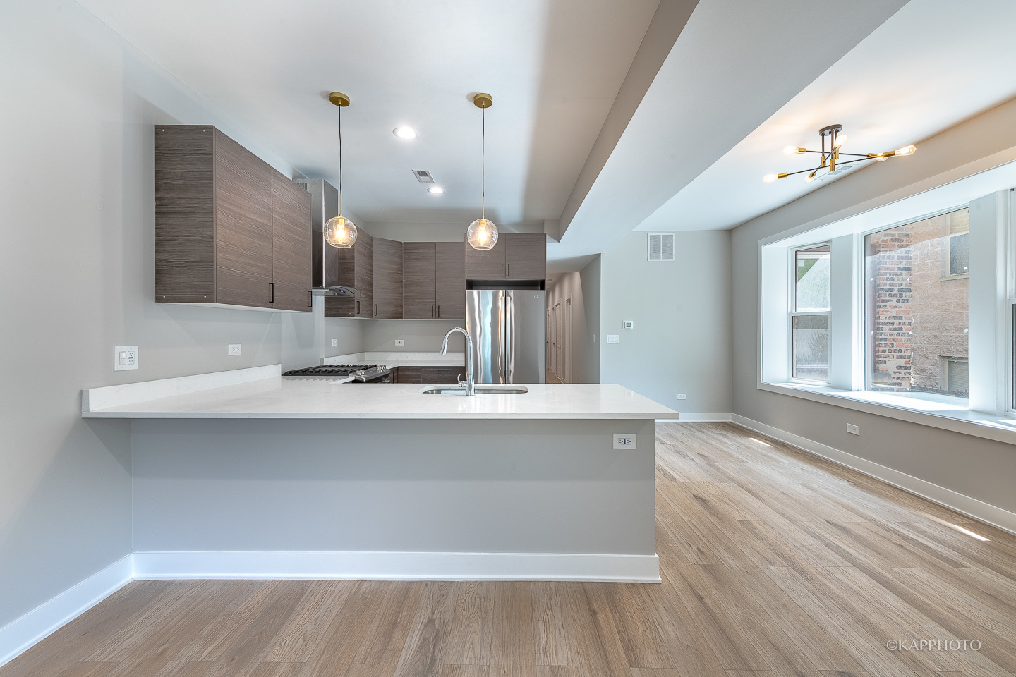 4152 South Prairie Avenue, Unit 1 Chicago, IL 60653 - Photo 17 of 27 a large white kitchen with a large window