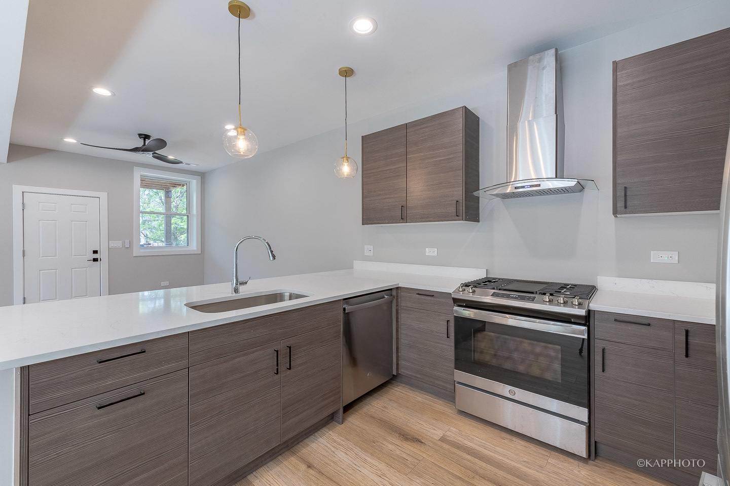 4152 South Prairie Avenue, Unit 1 Chicago, IL 60653 - Photo 18 of 27 a kitchen with a stove and a sink