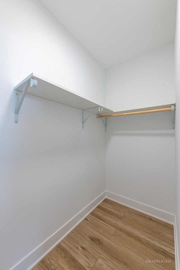 4152 South Prairie Avenue, Unit 1 Chicago, IL 60653 - Photo 19 of 27 a view of a room with wooden floor
