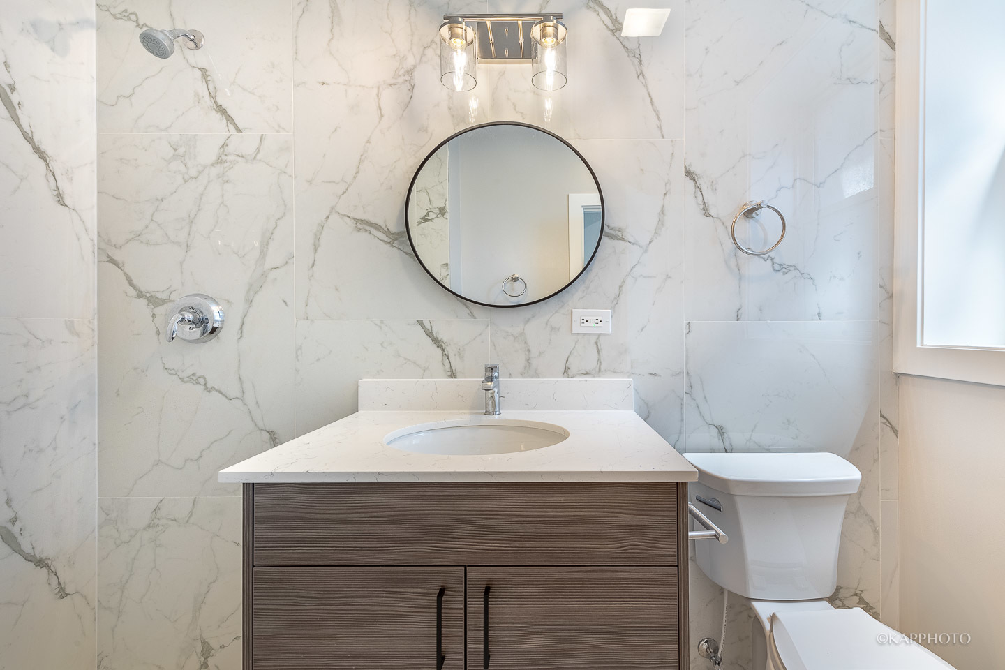 4152 South Prairie Avenue, Unit 1 Chicago, IL 60653 - Photo 22 of 27 a bathroom with a sink mirror vanity and toilet