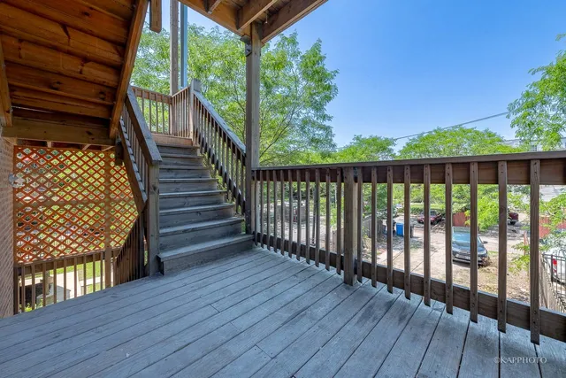 a view of balcony with wooden floor