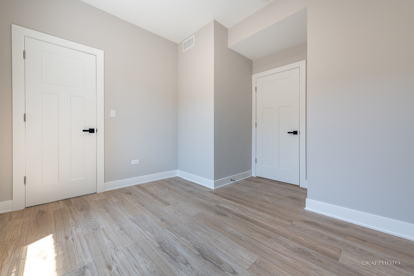 4152 South Prairie Avenue, Unit 1 Chicago, IL 60653 - Photo 6 of 27 a view of an empty room with wooden floor