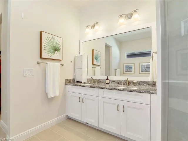 a bedroom with a bed and a television