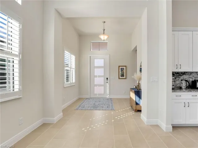 a view of a livingroom with wooden floor and a window