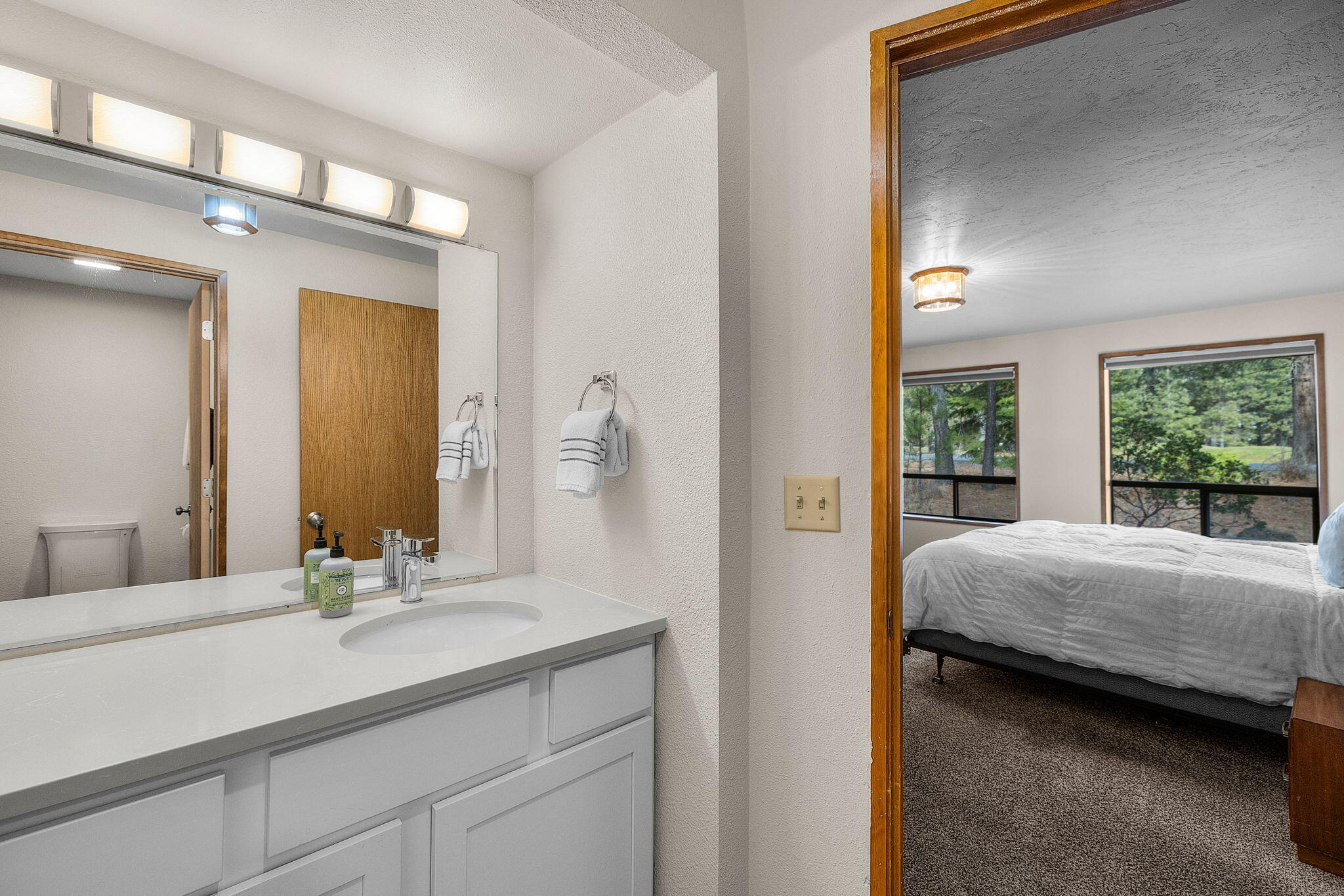 13168 Hawks Beard Black Butte Ranch, OR 97759 - Photo 15 of 47 a bedroom with a large bed and a dresser