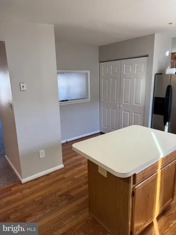 a room with a table and wooden floor