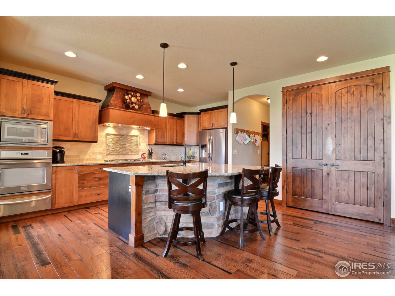1440 Red Tail Road Eaton, CO 80615 - Photo 9 of 40 Island, Pantry, and Granite