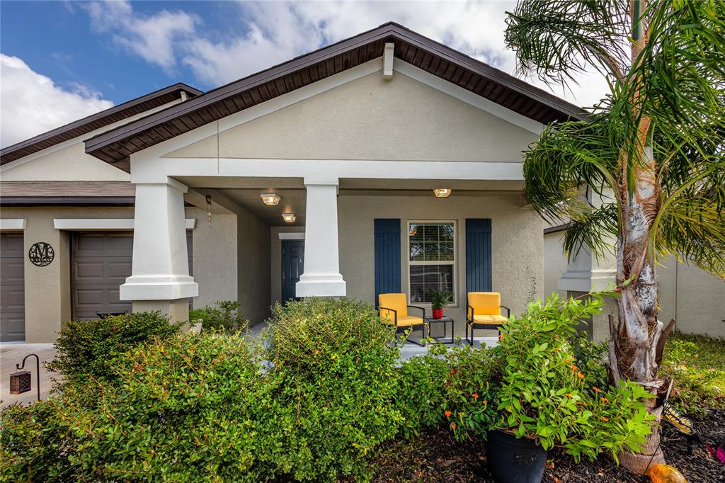 front view of a house with potted plants