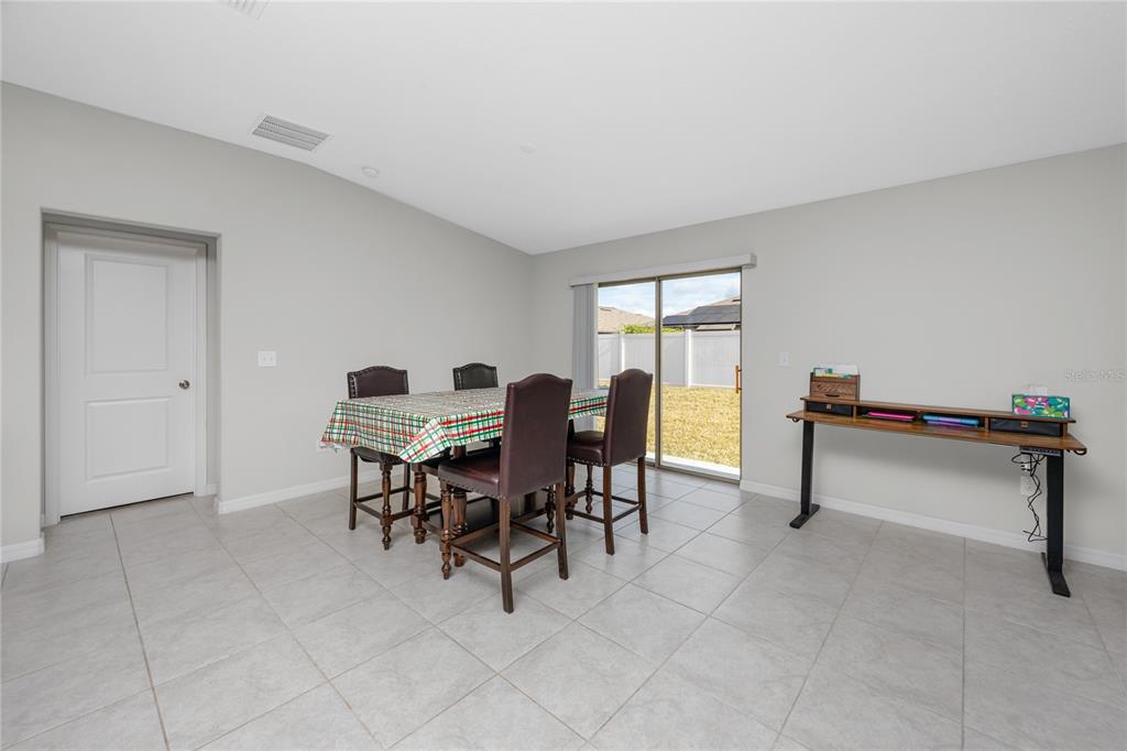 16654 Carlton Pond Street Wimauma, FL 33598 - Photo 14 of 48 a view of a livingroom with furniture and a work place