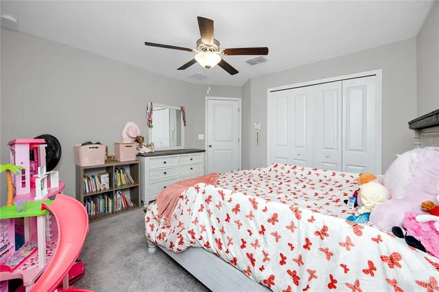 a bedroom with a bed and closet