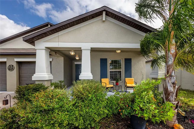 front view of a house with potted plants
