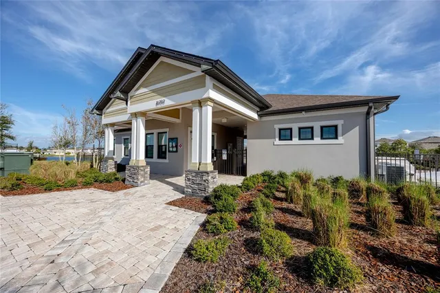 swimming pool with outdoor seating and lake view