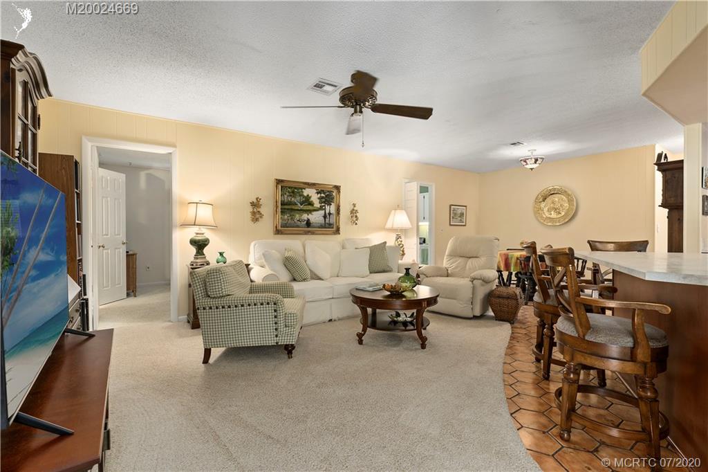 15 Banyan Road Stuart, FL 34996 - Photo 18 of 52 Inviting Family Room overlooks pool and kitchen.