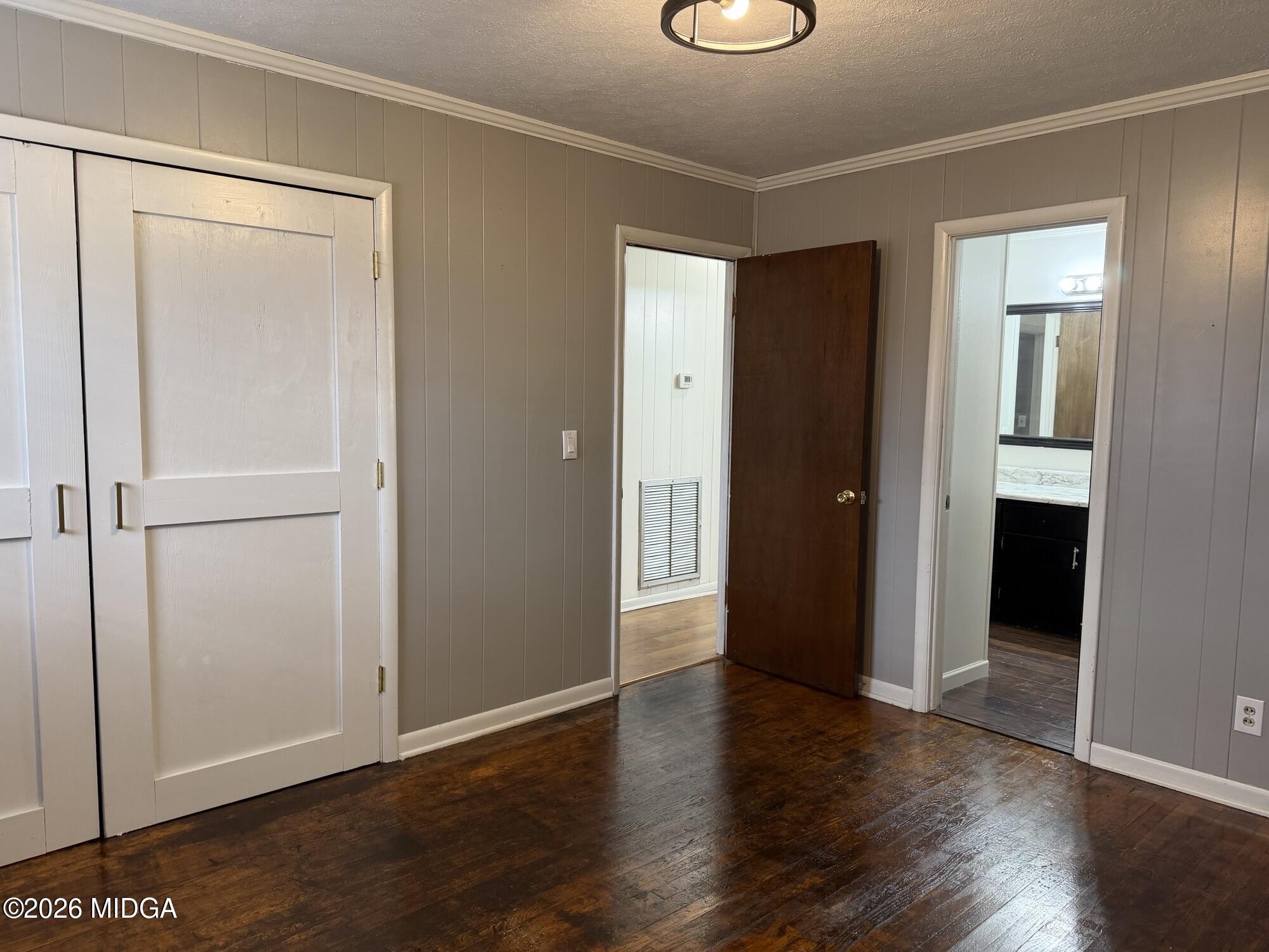 229 Southwest Peter Street Cochran, GA 31014 - Photo 19 of 24 an empty room with wooden floor & closet area