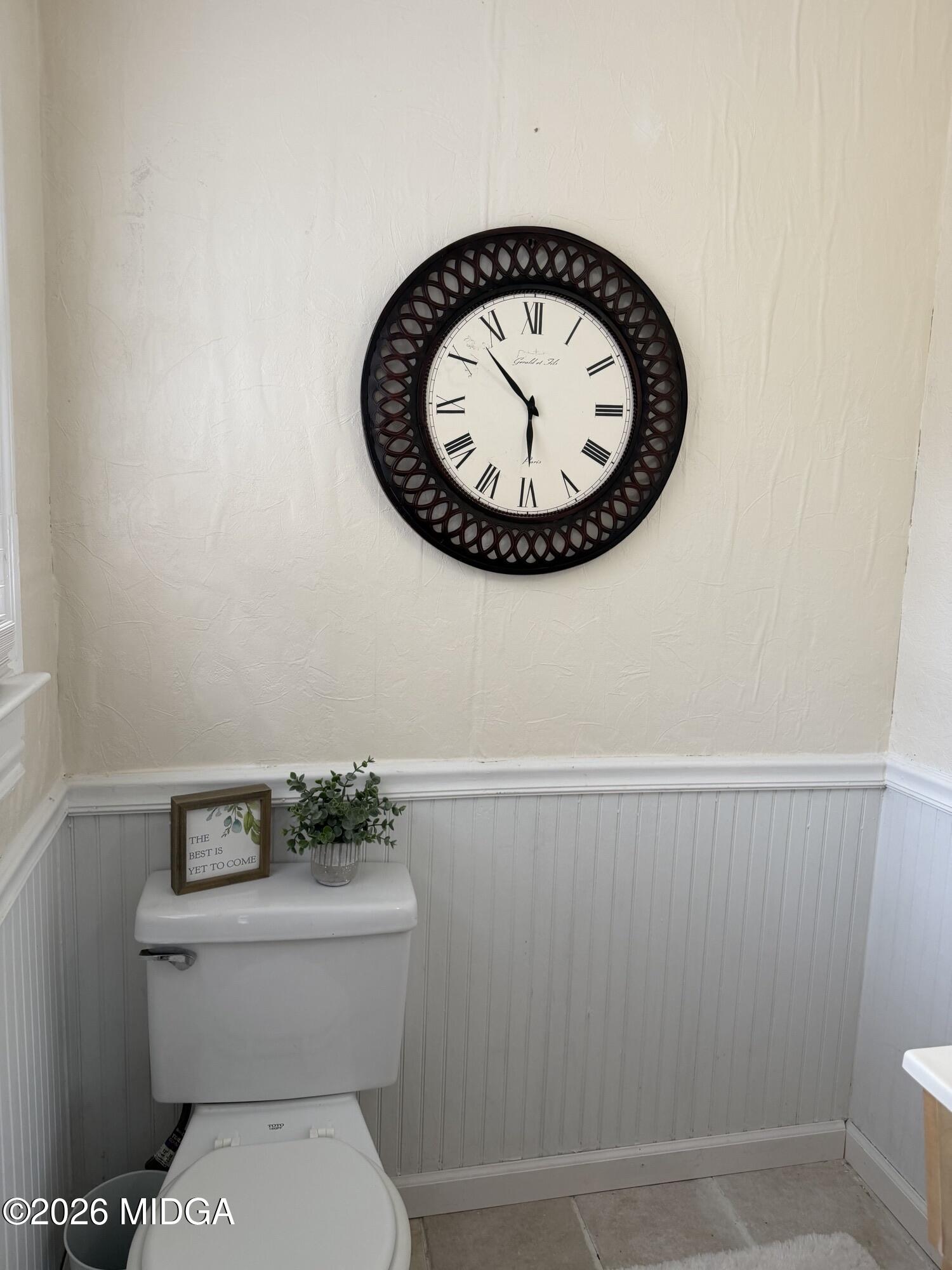 229 Southwest Peter Street Cochran, GA 31014 - Photo 20 of 24 a bathroom with a toilet and a sink