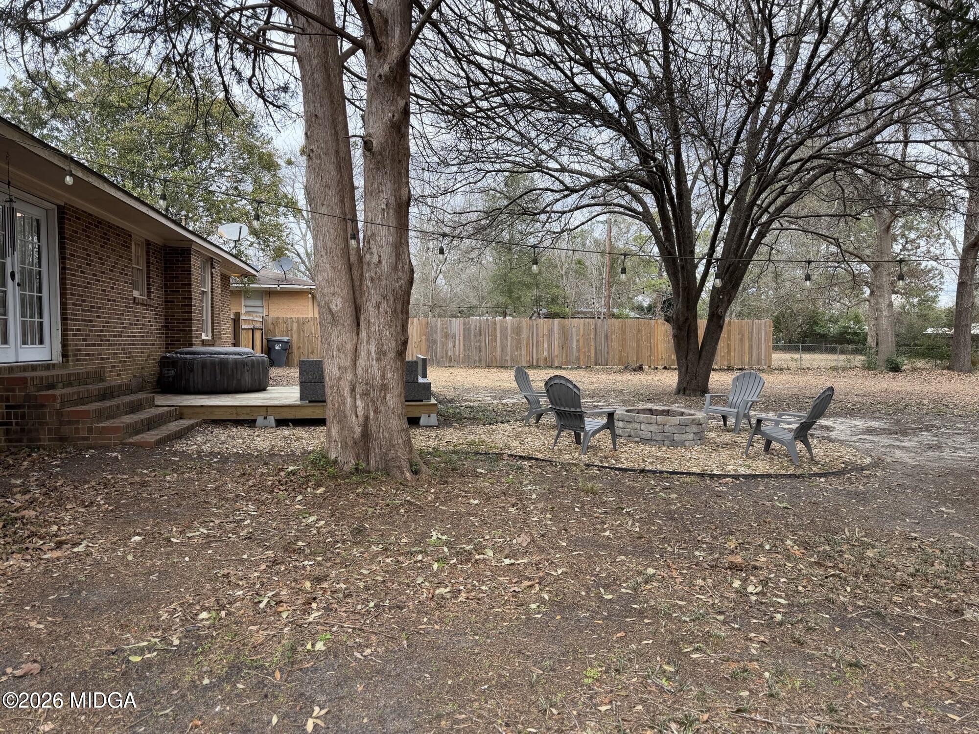 229 Southwest Peter Street Cochran, GA 31014 - Photo 23 of 24 a view of a yard with a tree