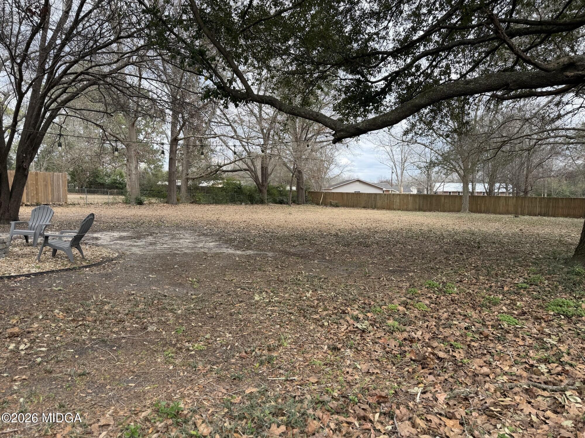 229 Southwest Peter Street Cochran, GA 31014 - Photo 24 of 24 a backyard of a house with lots of green space