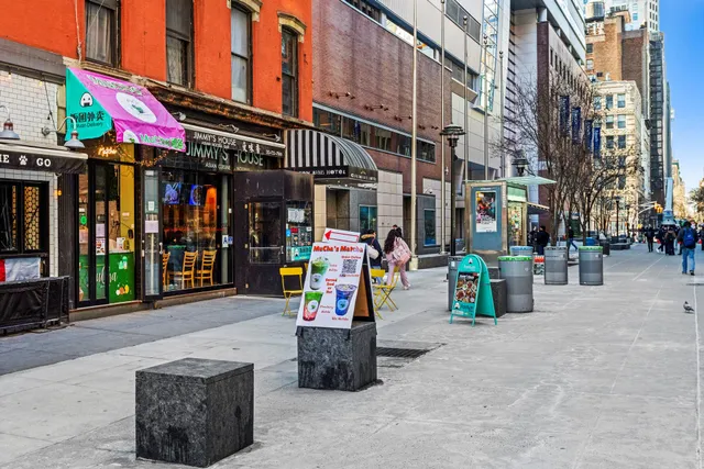 a view of street with sitting area