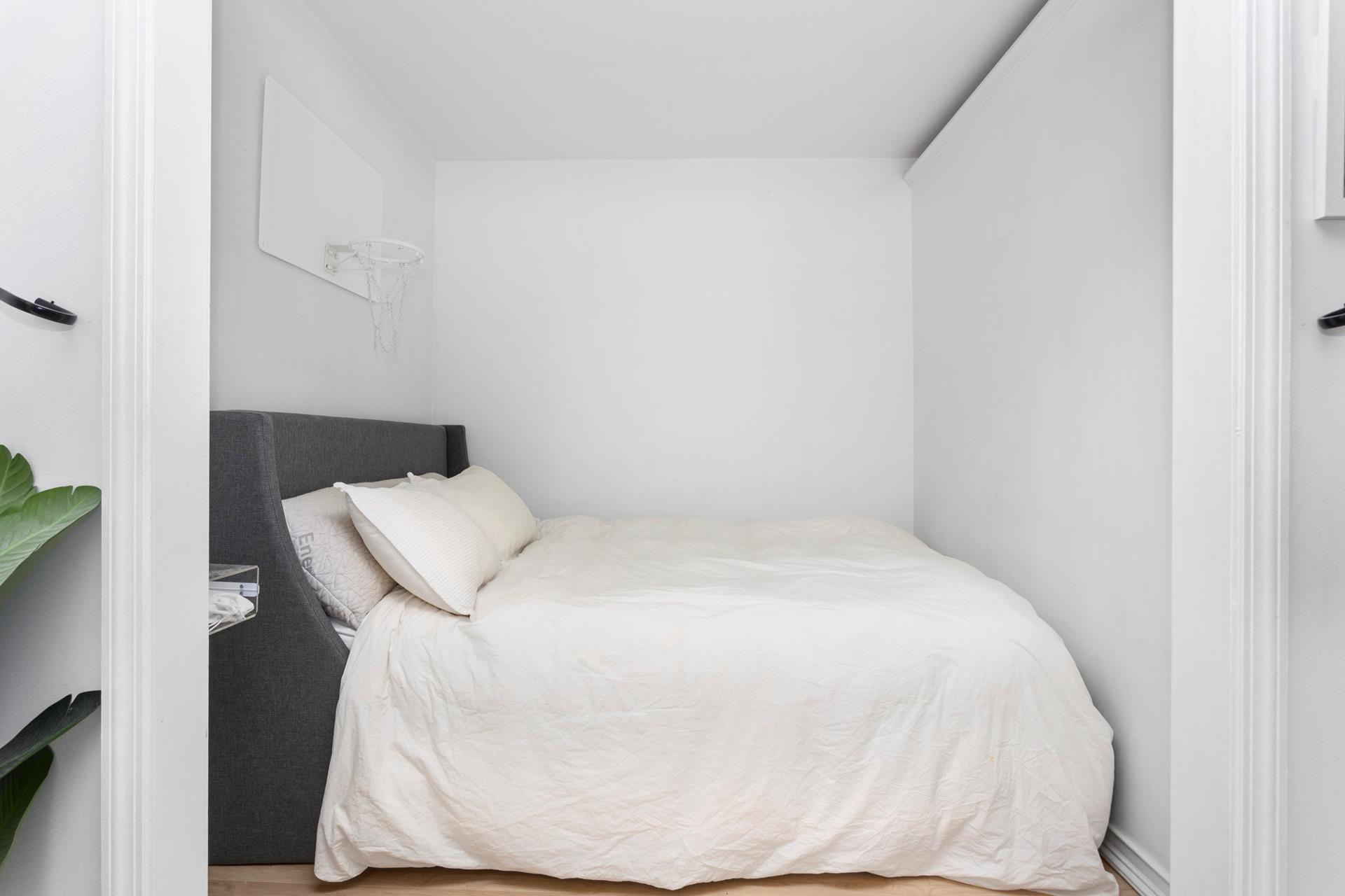 330 3rd Avenue, Unit 3L Manhattan, NY 10010 - Photo 9 of 13 a white bed in a white room