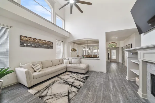 a living room with furniture and a fireplace