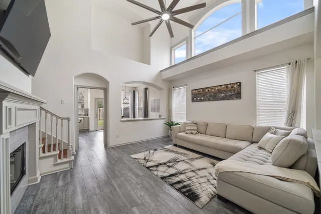 a living room with furniture and a fireplace