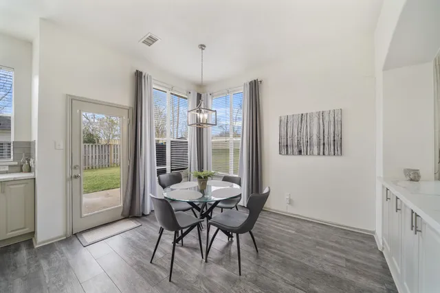 a workspace with furniture window and wooden floor