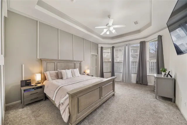 a bed room with a bed and a chandelier