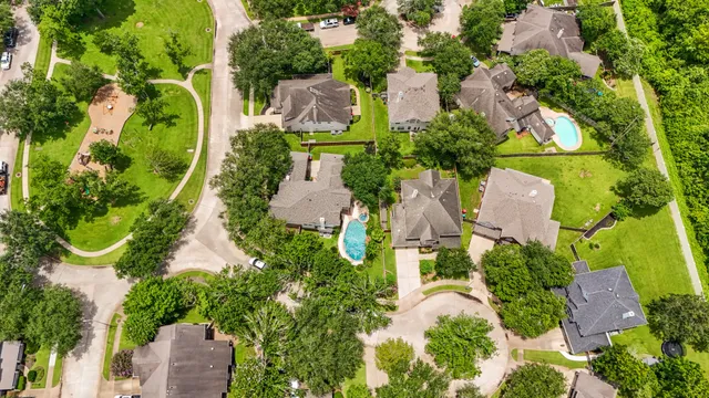 an aerial view of residential house with outdoor space and swimming pool